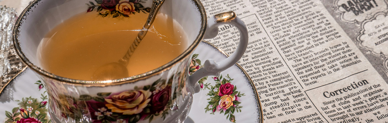 Cup and Newspaper Banner